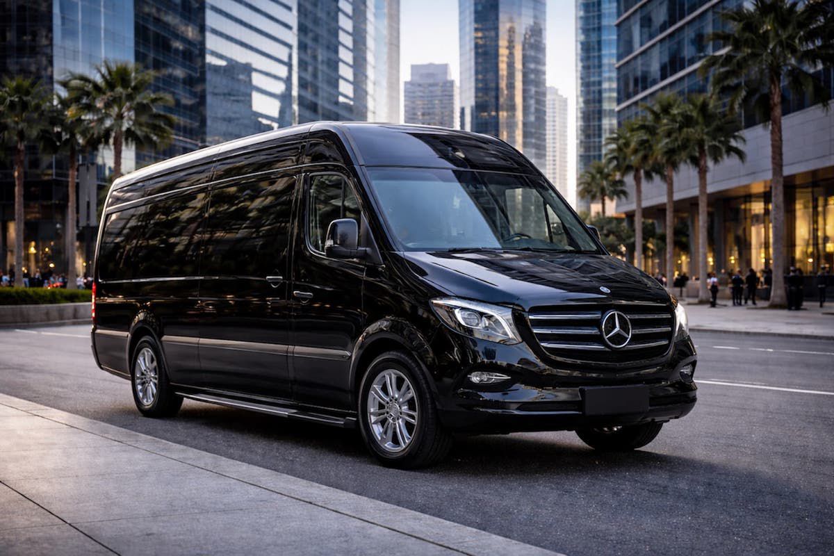 A black long-wheelbase Mercedes-Benz Sprinter van