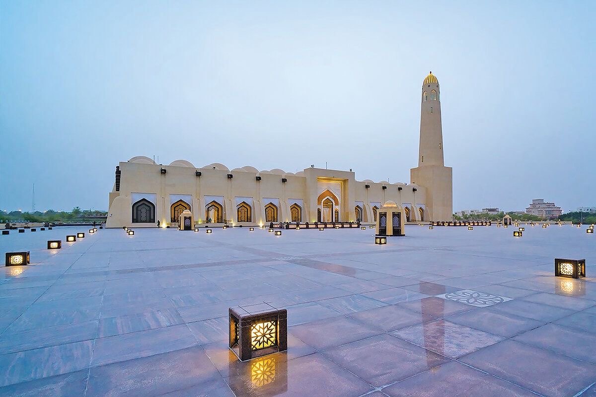 The lantern-lit courtyard of the Imam Abdul Wahhab State Grand Mosque at dusk