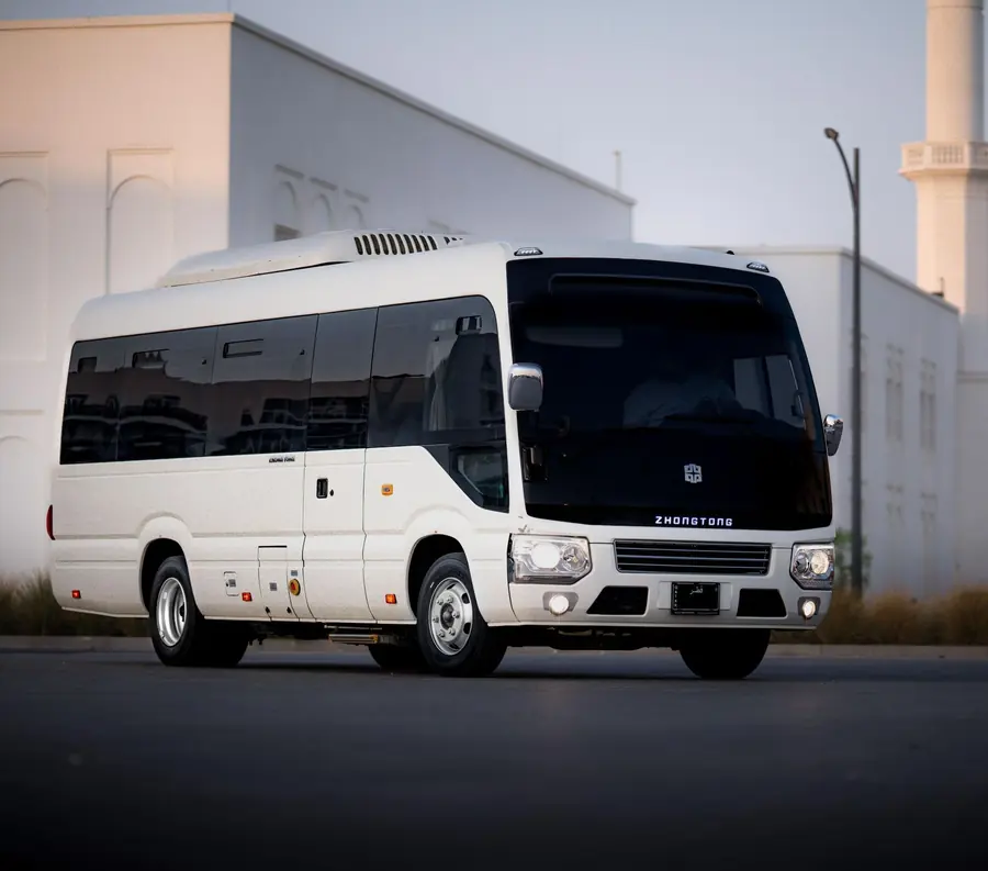 A white minibus used for smaller group journeys