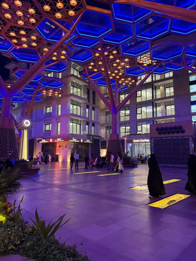 The lit canopy of Msheireb Downtown glowing after dark