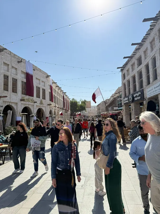 The main alley of Souq Waqif busy with afternoon visitors