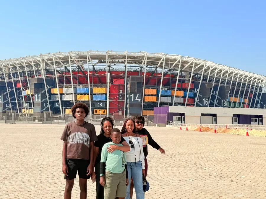 A family of five outside Stadium 974
